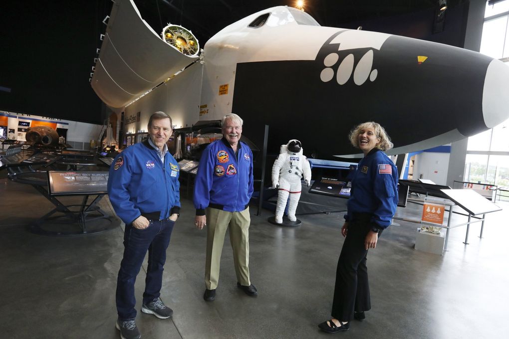 Astronauts Gregory C. Johnson, John Creighton and Dottie Metcalf-Lindenburger know NASA's space shuttle trainer at the Seattle Museum of Flight. All three used this coach for their shuttle missions. (Ken Lambert / The Seattle Times)