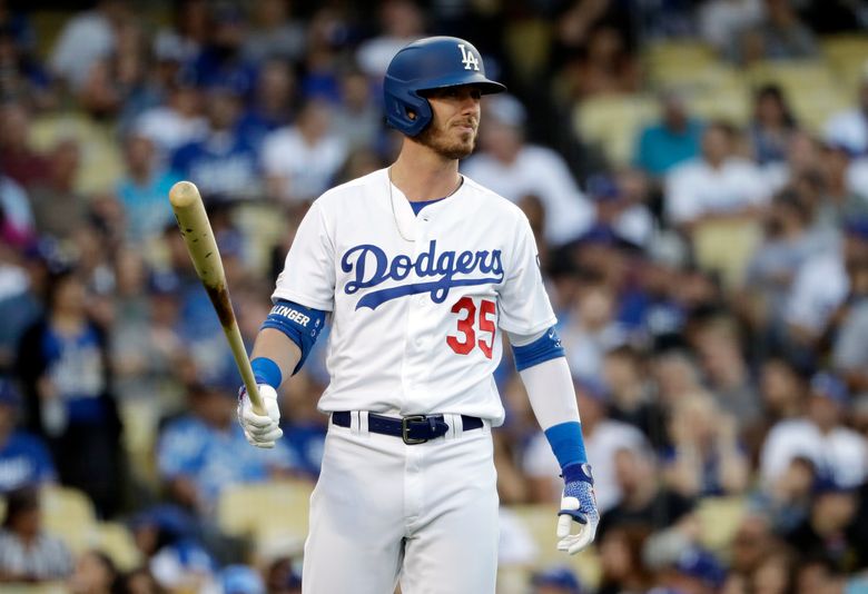 Los Angeles Dodgers' Cody Bellinger steps off the batter’s box during ...
