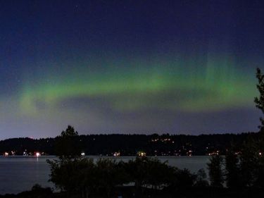 A time-exposure photograph of aurora borealis, taken from the roof of the National Weather Service offices near Warren G. Magnuson Park in Seattle. (National Weather Service)