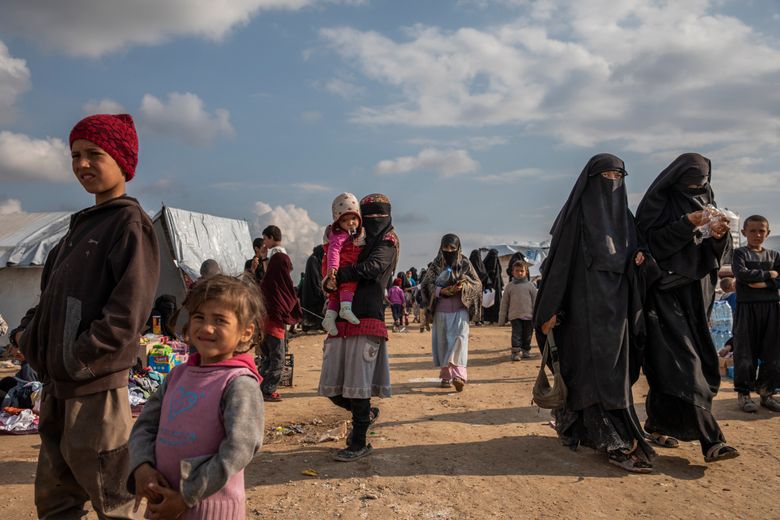 Women and children who fled the Islamic State are seen last spring in the foreigners section at the Kurdish-controlled al-Hol camp in northern Syria. Analysts say that President Donald Trump’s pullout of American troops from northern Syria has handed the Islamic State its biggest win in more than four years. (Ivor Prickett/The New York Times)