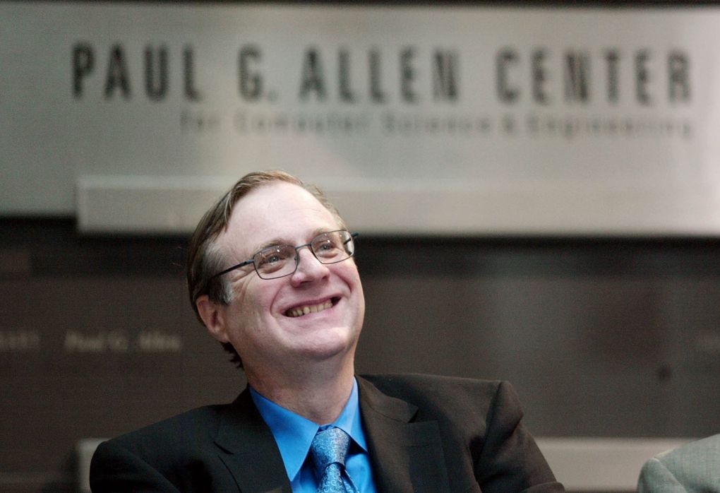 Paul Allen smiles as he listens during the dedication of the Paul G. Allen Center for Computer Science & Engineering at the University of Washington in October 2003. In 2017, the computer science department became the Paul G. Allen School for Computer Science & Engineering after he contributed another $40 million. (AP Photo/John Froschauer)
