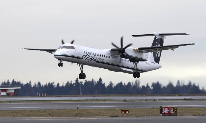 A Horizon turboprop operated by Alaska Airlines Horizon Air at Seattle-Tacoma International Airport in Seattle. The Ninth Circuit Court of Appeals has directed the FAA to go back to the drawing board on the Burien flight path. (Ted S. Warren / AP)