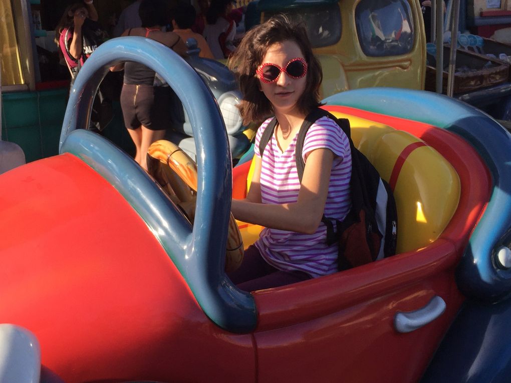 A trip to DisneyLand seems routine to many families, but it can be a difficult trip with kids with disabilities. Here, Olivia Duin smiles at on the amusement park’s Autotopia ride. (Julia Duin)