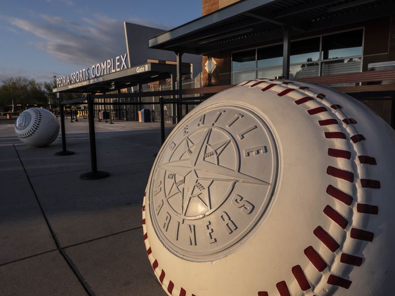 The Mariners and Padres logos are on concrete baseballs that line the Peoria Sports Complex. The Chicago Cubs played the Seattle Mariners in Spring Training baseball Monday, February 24, 2020 at Peoria Sports Complex. (Dean Rutz / The Seattle Times)