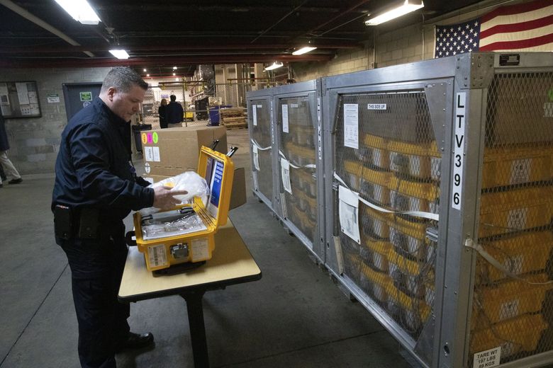 Vincent Dellova, a coordinator at the New York City Emergency Management Warehouse, packs up a ventilator, part of a shipment of 400, that arrived Tuesday, March 24, 2020 in New York.  (Mark Lennihan / AP)