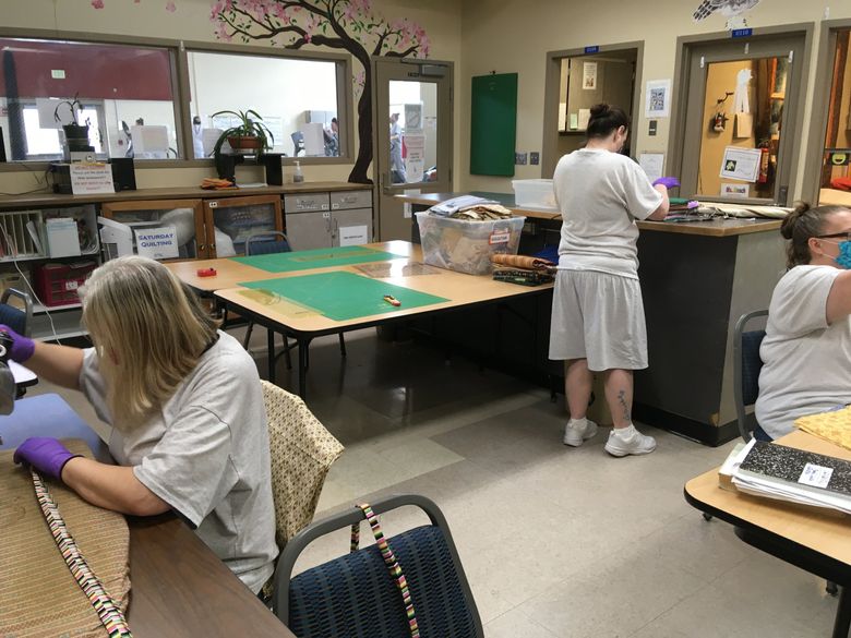 Members of the Washington Correction Center for Women’s Sisters of Charity stitch gowns to be donated to area fire and rescue, as well as masks for inmates. (Courtesy of Washington Corrections Center for Women)