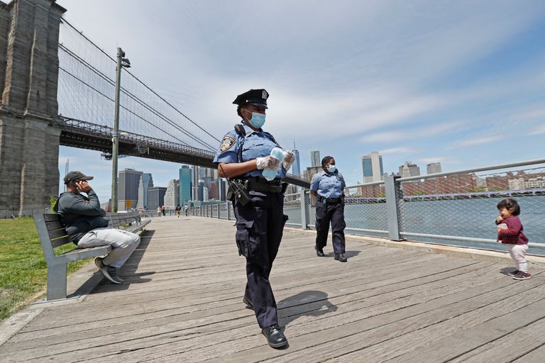 A youngster approaches a team of New York City police officers