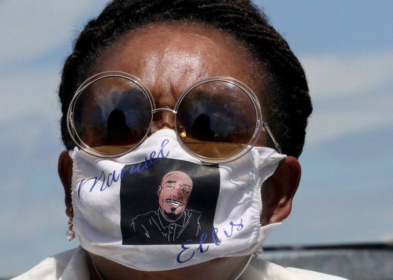 Marcia Carter, mother of Manuel Ellis, says she’s “tired of crying. Tired of being sick and tired.” On her face mask she has a... (Alan Berner / The Seattle Times) 