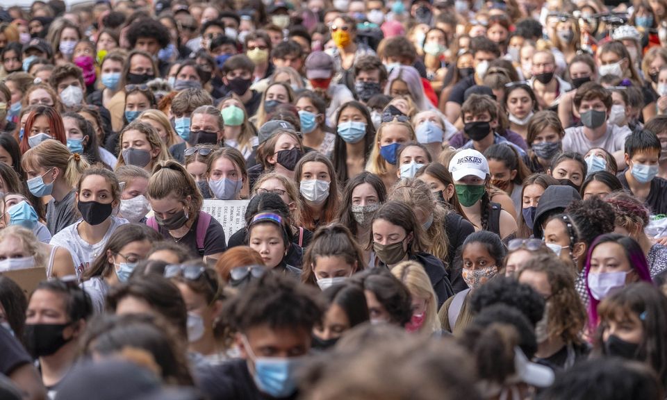 COVID-19 cases have risen locally and nationwide, but some researchers say the George Floyd protests do not appear to be significantly driving this surge. Above, some 1,000 people in the Seattle Youth Protest sit on June 10 in the intersection of... (Dean Rutz / The Seattle Times) 