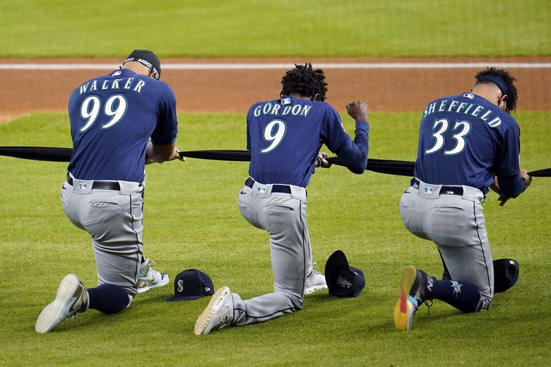 Six Seattle players raise fists during national anthem after ...