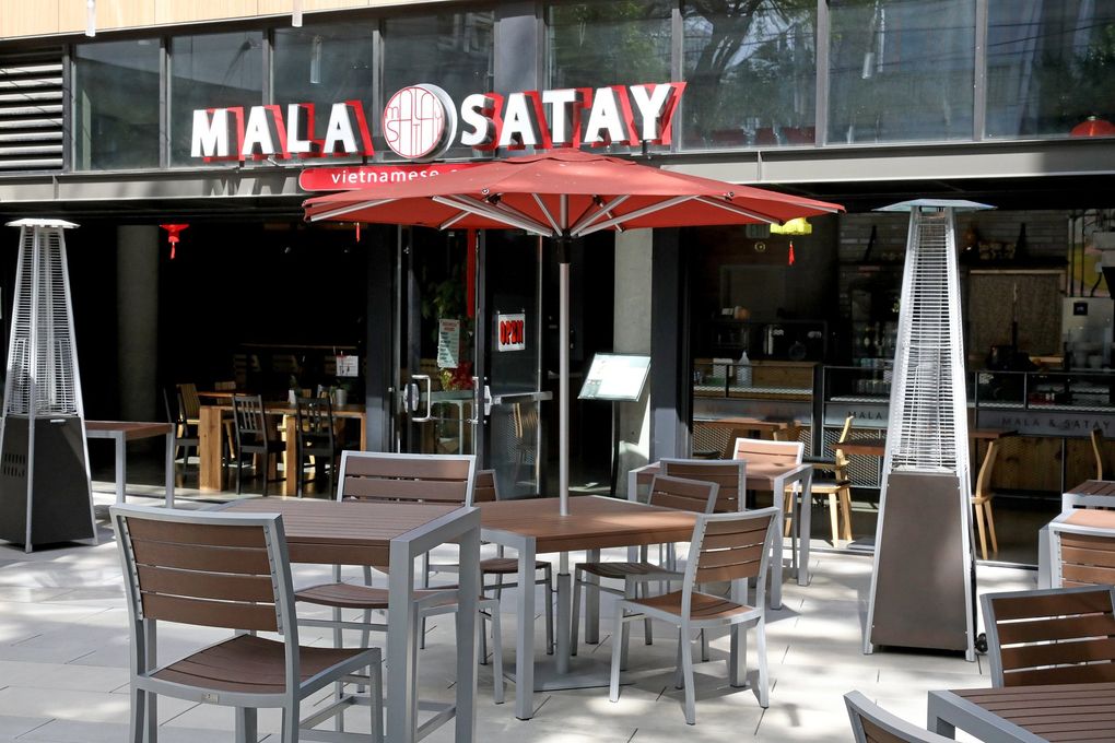 Mala Satay in Seattle's South Lake Union neighborhood closed in March and reopened this month, but business has gone down significantly without regular Amazon customers.  (Greg Gilbert / The Seattle Times)