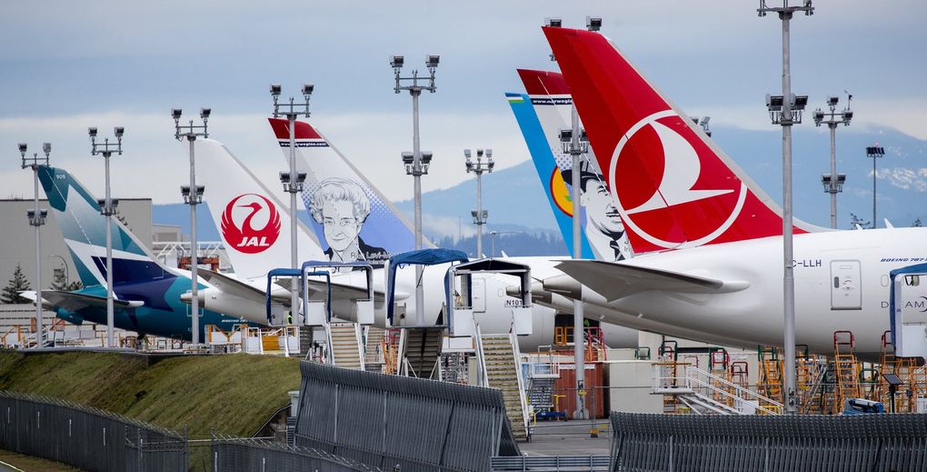 Tail sections from Boeing 787 and 777 jets in various stages of completion sit near the delivery center at Paine Field in Everett in January. (Mike Siegel / The Seattle Times)