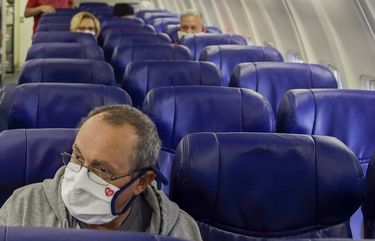 A Southwest Airlines flight attendant is preparing to fly to an almost empty plane in Orlando, Florida, to take off at Kansas City International Airport in May.  (Charlie Riedel/Associated Press) 