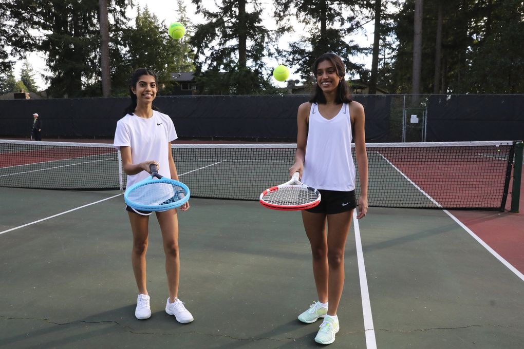 From left: sisters Sahithi and Shriya Challam, Tuesday, Oct. 27, 2020 in Bellevue. Interlake senior Shriya has started a nonprofit called Time to Tennis (timetotennis.org) that aims to bring economic diversity to tennis.  (Ken Lambert / The Seattle Times)