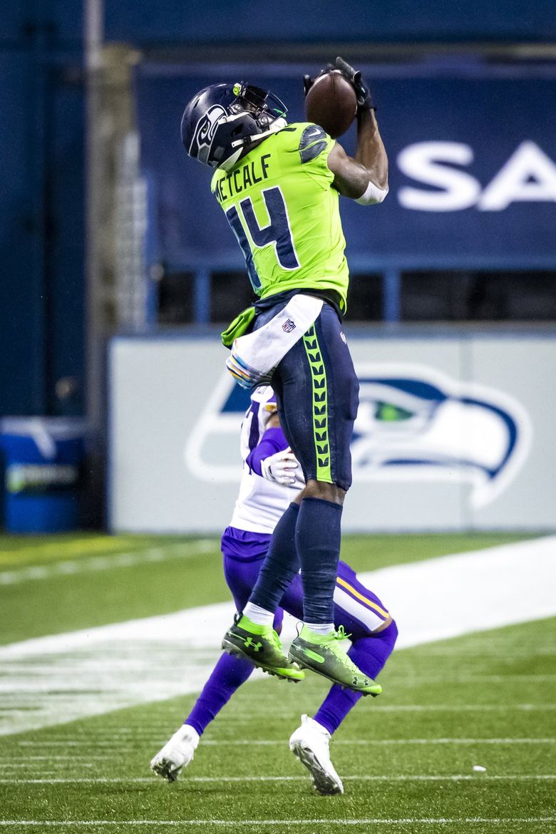 Seahawks wide receiver DK Metcalf catches a 39-yard pass from Russell Wilson on the final game-winning drive as the Seattle Seahawks take on the Minnesota Vikings at CenturyLink Field in Seattle Sunday October 11, 2020. 215325 (Bettina Hansen / The Seattle Times)