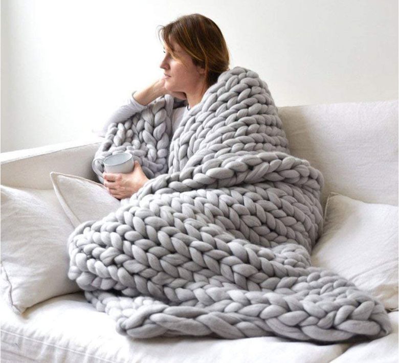 A soft, chunky blanket can be added to any room to provide an element of warmth and comfort. (Courtesy of Erlyeen)
