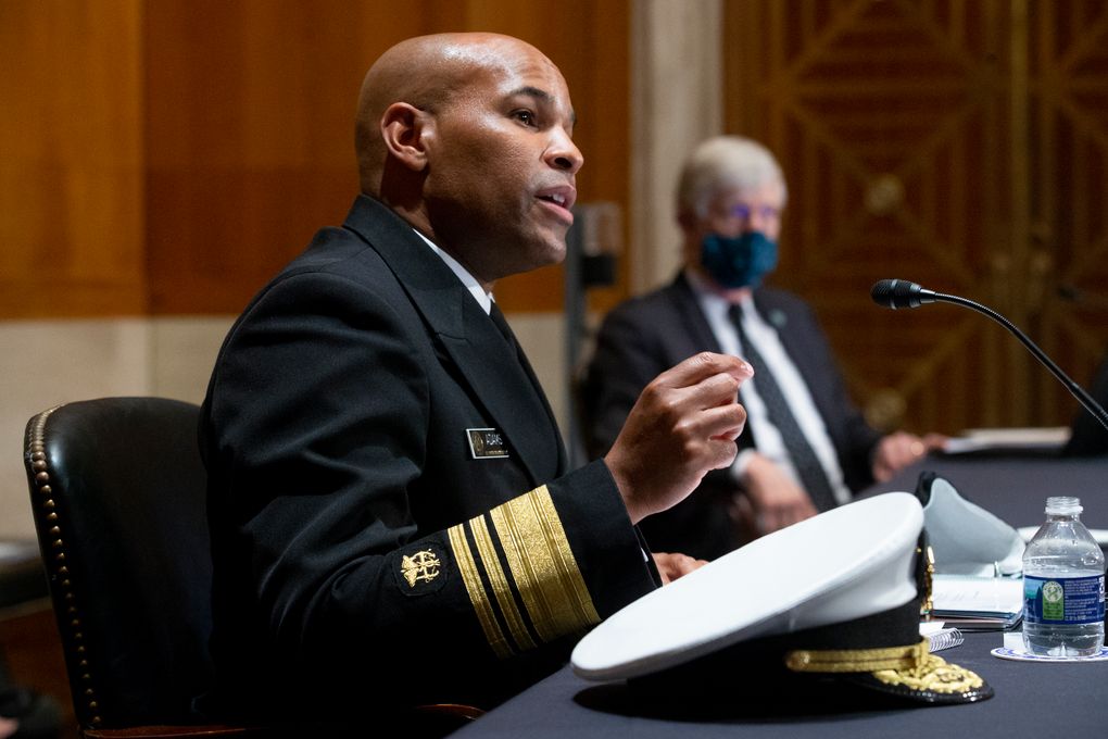 FILE – In this Sept. 9, 2020 file photo Surgeon General Jerome Adams, appears before a Senate Health, Education, Labor and Pensions Committee hearing on Capitol Hill, in Washington. Adams was cited for being in a closed Hawaii park in August while in the islands helping with surge testing amid a spike in coronavirus cases, according to a criminal complaint filed in court. (Michael Reynolds/Pool via AP,File)