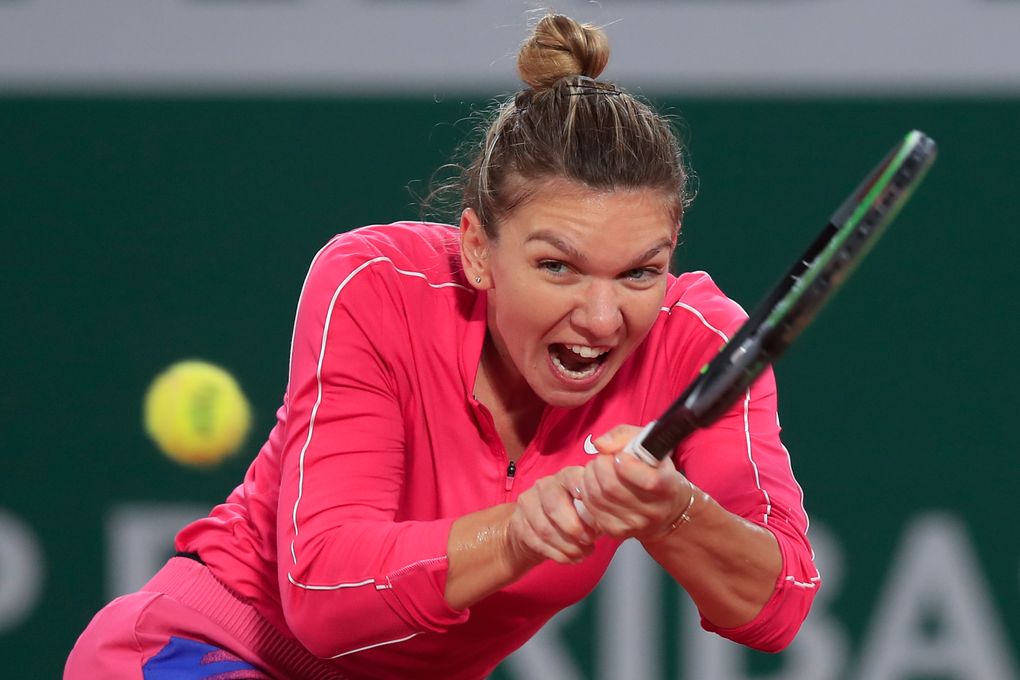 File – In this file photo dated October 4, 2020, Simona Halep of Romania won the French Open tennis tournament at the Roland Garros stadium in Paris, France. In the four rounds, against Poland's Iga Swiatek (Iga Swiatek). Simona Halep said on Saturday, October 31, 2020 that she has tested positive for the COVID-19 coronavirus.  (AP Photo/Michelle Euler, file)