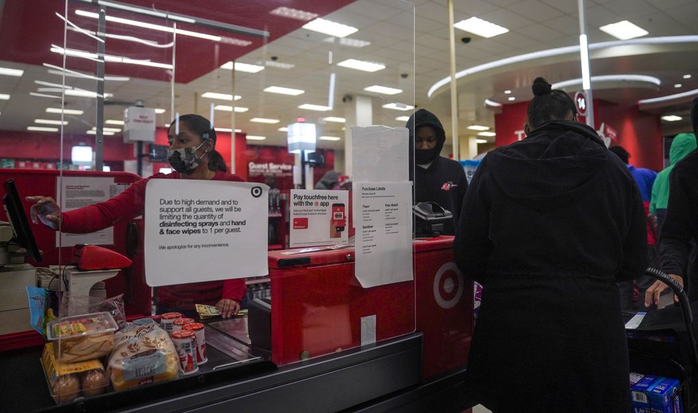 A leftist colleague attracts customers to buy at a Target store in New York on Tuesday, October 20, 2020. The coronavirus pandemic is changing the way this year’s holiday recruitment is, and companies are beginning to hire earlier and provide additional security agreements.  Target said it expects to hire more than 100,000 people during the holidays.  (AP Photo/Bebeto Matthews)