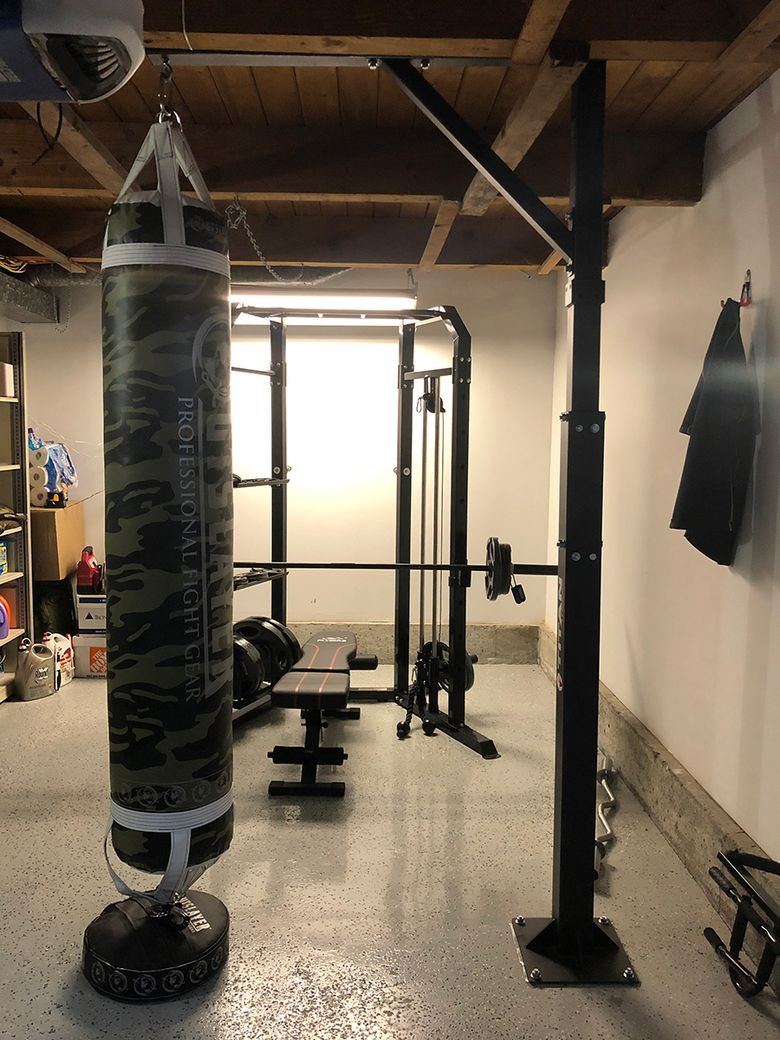 Tuvache Betton converted his Renton garage into a workout space by applying a coat of epoxy to the floor and adding a heavy bag and other equipment. (Courtesy of Tuvache Betton)