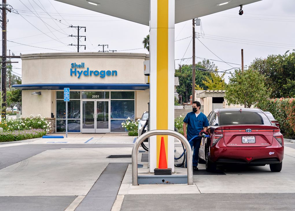 A motorist fills a Toyota Mirai, a hydrogen-powered car, at a gas station in Torrance, Calif., on Oct. 22. (Philip Cheung / The New York Times)
