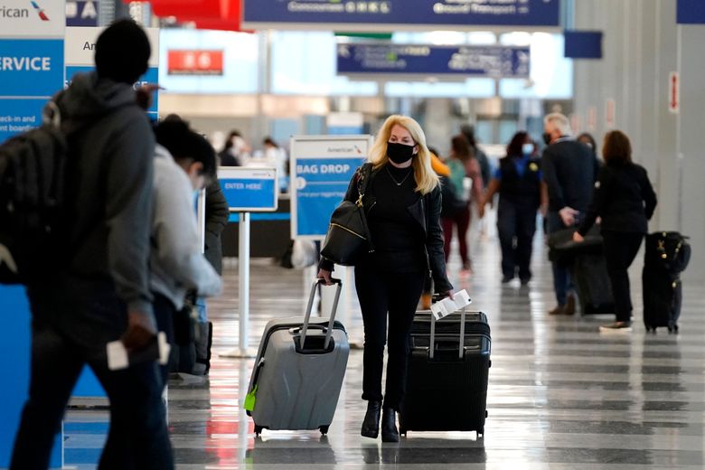 Holiday air travel surges despite dire health warnings | The Seattle Times