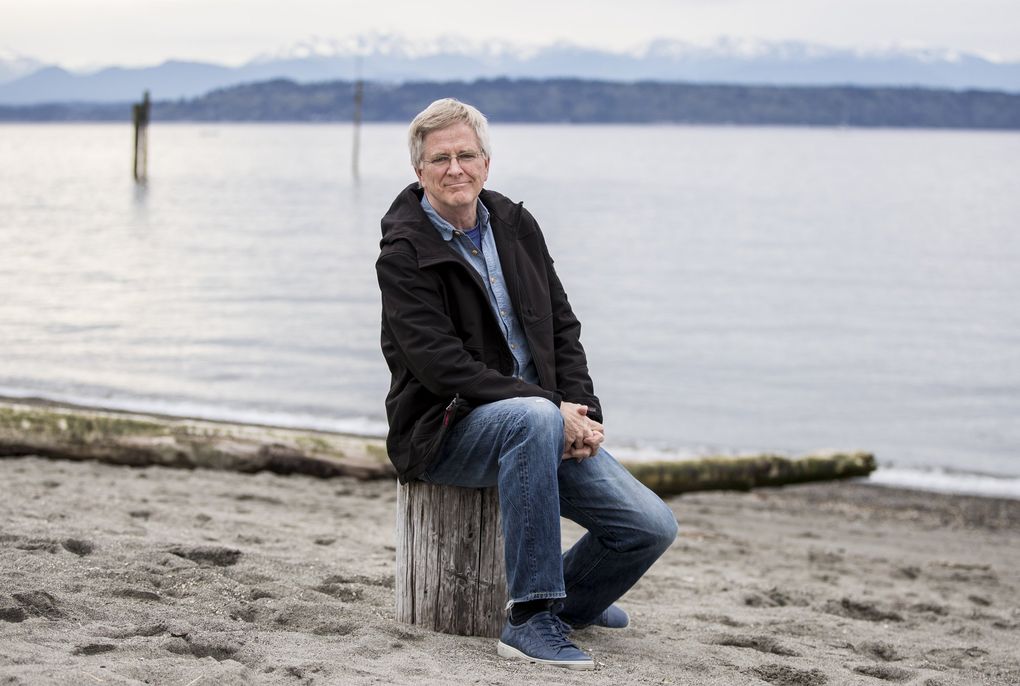Edmonds resident Rick Steves on the beach in downtown Edmonds in 2020. Steves is known for his guidebooks and popular European vacation tours. The coronavirus has essentially shut down his touring business, but Steves says he’s in a position to survive two lean years, if necessary. (Amanda Snyder / The Seattle Times) 
