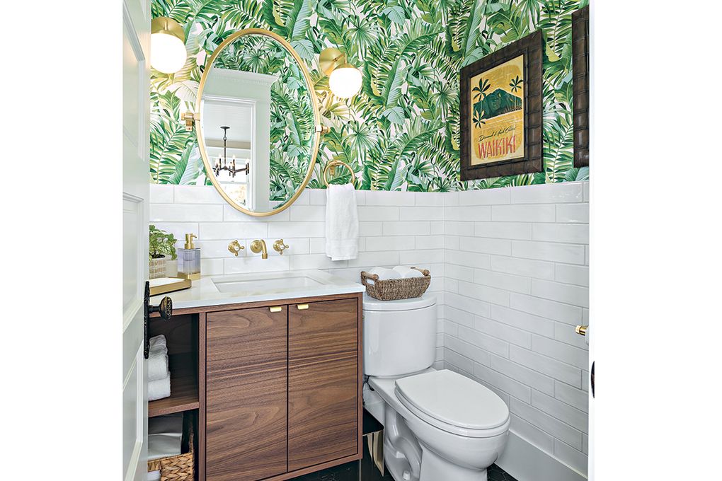 Emma Zimmerman, of Seattle-based Model Remodel, says people are taking decorating inspiration from their travels. The firm recently designed this Hawaiian-themed powder room that features palm leaf wallpaper. (Courtesy of Cindy Apple 
Photography via Model Remodel)
