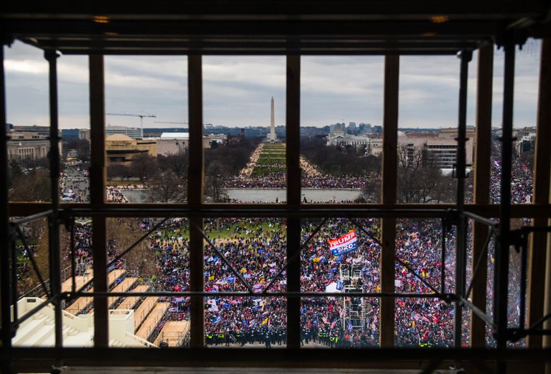 Rioters surround the Capitol on Wednesday, Jan. 6, 2021. (Photo by Amanda Voisard for The Washington Post).
