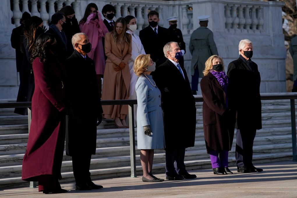 Former President Barack Obama and his wife Michelle, former President George W. Bush and his wife Laura and former President Bill Clinton and his wife former Secretary of State Hillary Clinton on Jan. 20 stand at the Tomb of the Unknown Soldier at Arlington National Cemetery during Inauguration Day ceremonies in Arlington, Va. (AP Photo/Evan Vucci, file)