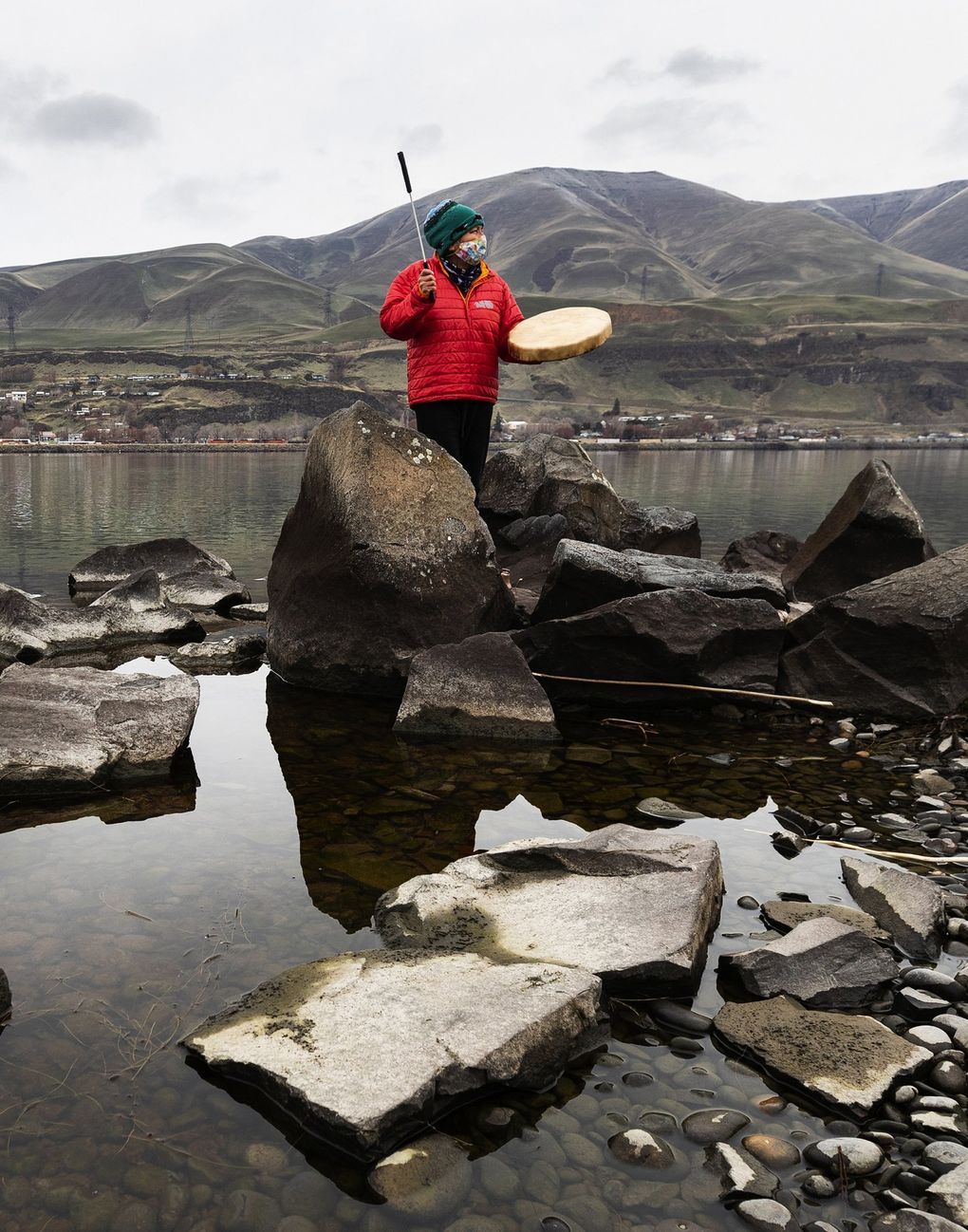 Lana Jack, a Celilo Wyam Indian, offers a prayer and a song for the Columbia River at Celilo Park in Oregon on Dec. 29. The park is the former site of Celilo Falls, which was flooded by The Dalles Dam. (Andy Bao)