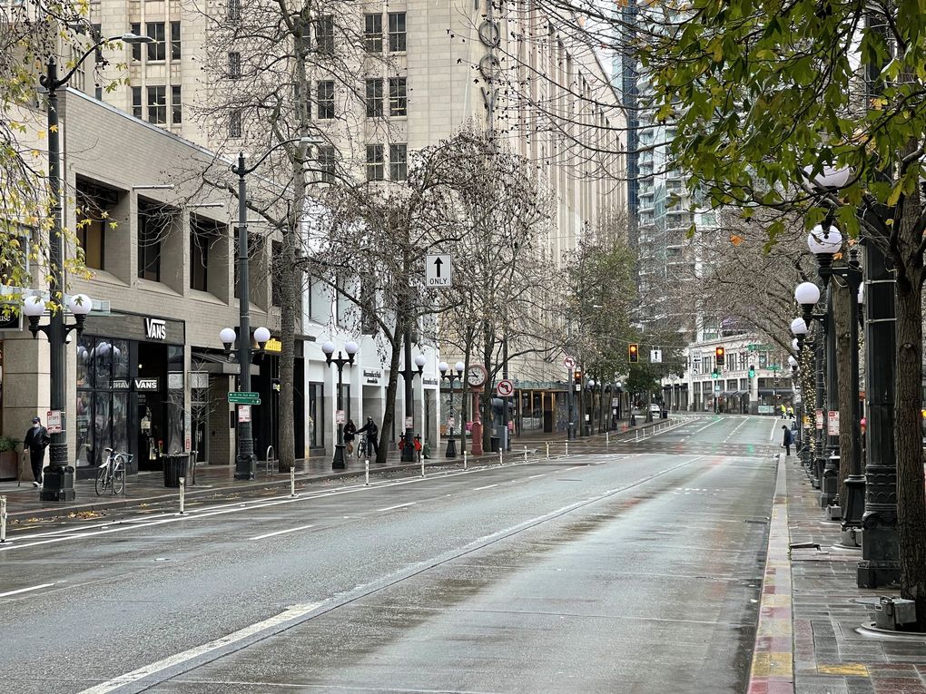 Fourth Avenue, in downtown Seattle’s main shopping district, is oddly deserted on a Thursday midmorning. (Steve Ringman / The Seattle Times)