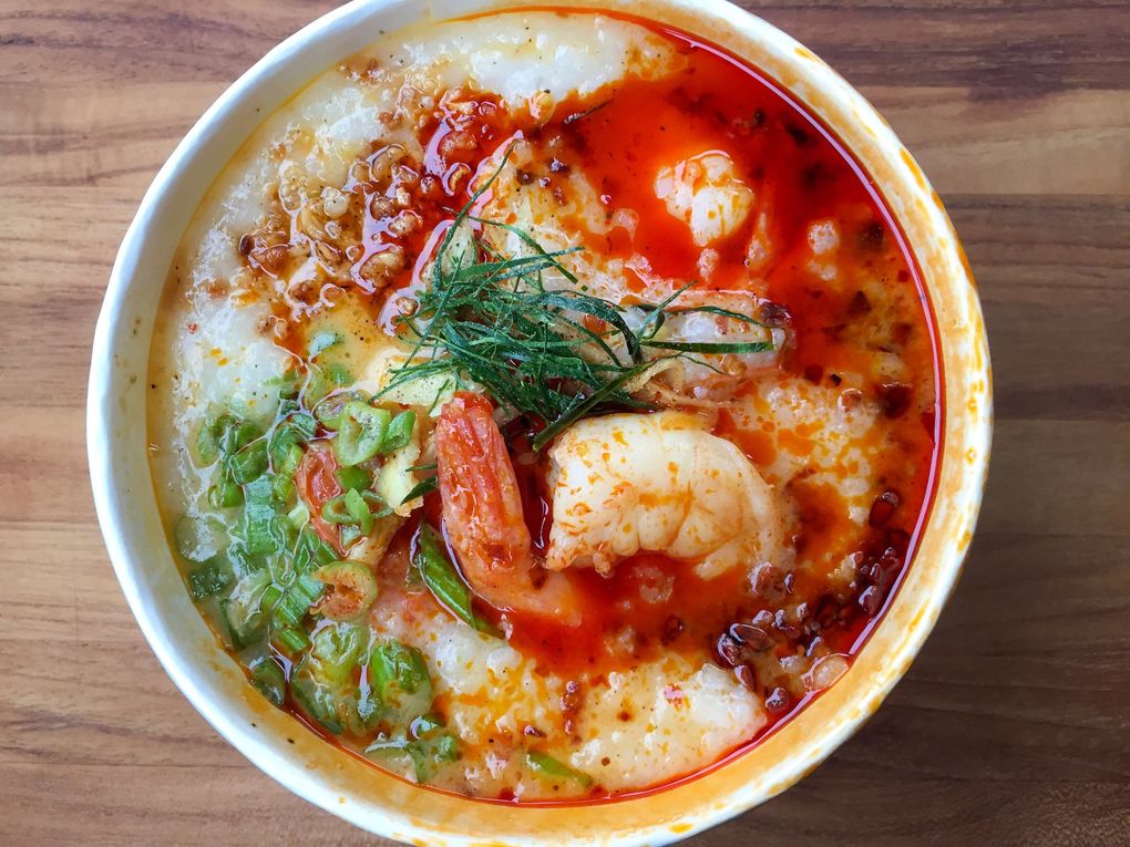 The tom yum shrimp congee from Secret Congee looks and smells so beautiful, you should open it up and eat it without delay. (Bethany Jean Clement / The Seattle Times)