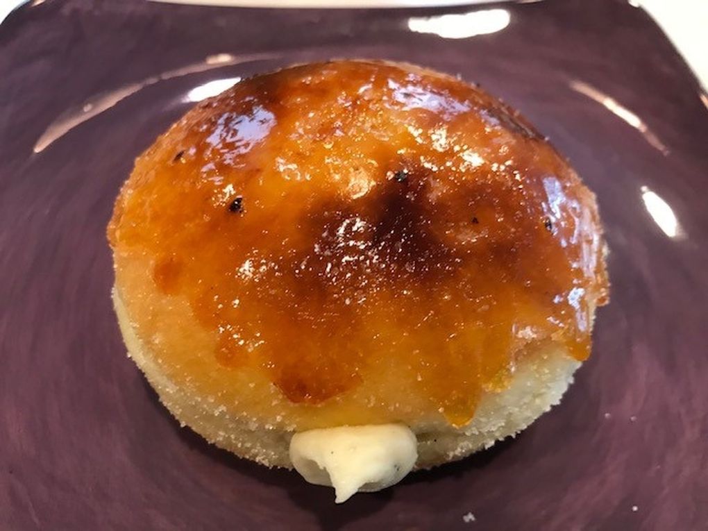 Our food critic Tan Vinh declared the crème brûlée brioche doughnut with a vanilla custard filling from The Flour Box the best doughnut in Seattle. (Tan Vinh / The Seattle Times)