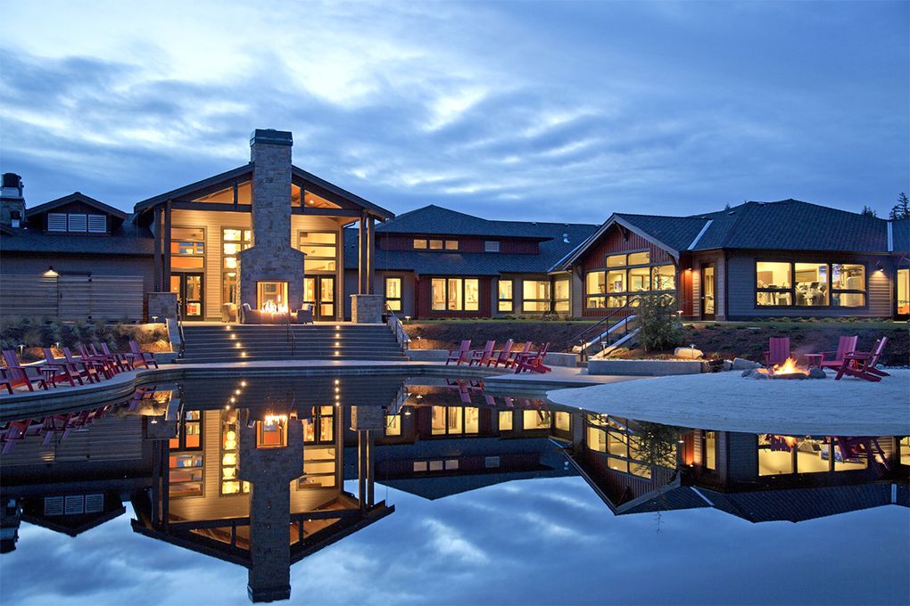 Seven Summits Lodge features an upscale restaurant, a fitness studio and an indoor lap pool that transforms into an event space. It is surrounded by Reflection Lake.