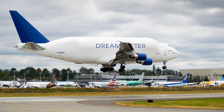 A Boeing Dreamlifter, bringing 787 parts from Nagoya, Japan, lands at Paine Field in Everett on July 24, 2020. (Mike Siegel / The Seattle Times)