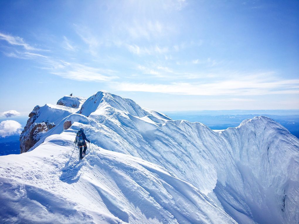 Theresa Silveyra walks the summit ridge of Mount Hood during a climb of the Leuthold Couloir route.  (Mack Robertson)