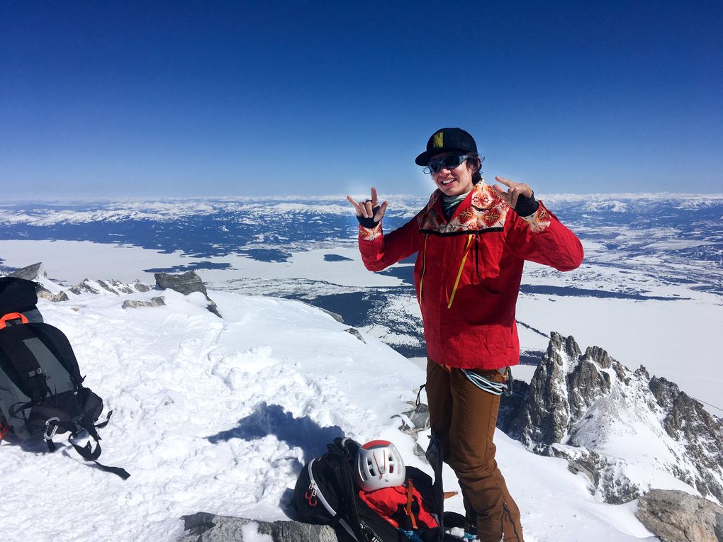 Cal’ Smith poses from the summit of Grand Teton in Wyoming in March 2021 wearing a ribbon shirt made by his mother. (Dae Wunt)