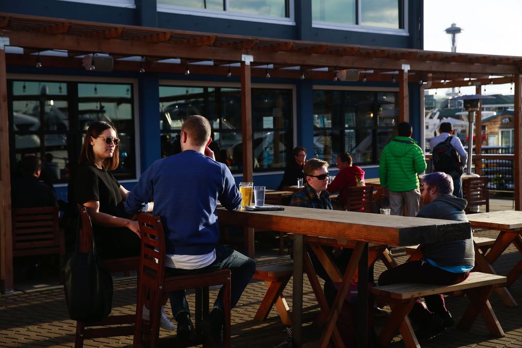 The White Swan Public House on Lake Union, pictured in this file photo from April 2017, still has one of the best outdoor dining atmospheres in all of Seattle. (Erika Schultz / The Seattle Times)