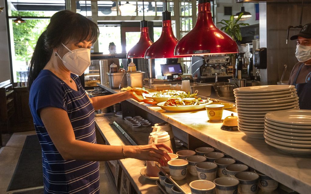  At Ba Bar in South Lake Union, co-owner Teresa Nguyen picks up an order to take to a table last week. Nguyen and her husband, Eric Banh, have to work the front of the house because they can’t find servers, hosts... 