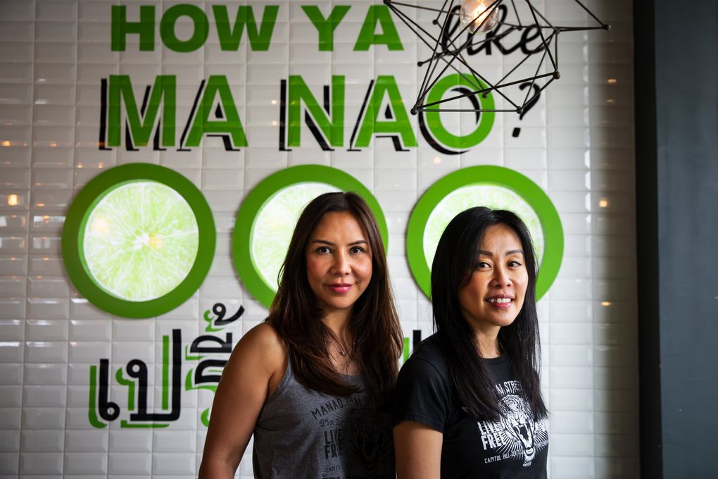 Teeraya Silpi, left, and Montida Lertkiatsakul became friends while waiting tables at a Thai restaurant in Bothell — now they run Seattle’s beloved Manao Thai Street Eats. (Bettina Hansen / The Seattle Times)