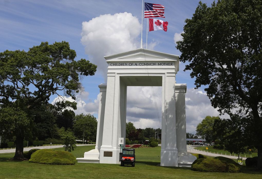The Peace Arch stands out in a park setting that straddles the U.S.-Canada border. The grounds are a popular reunion site for loved ones separated by the COVID restrictions. (Greg Gilbert / The Seattle Times)