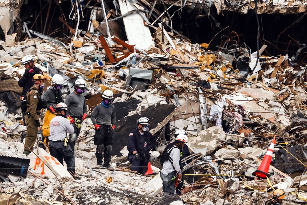First responders continue to search for missing residents at the Champlain Tower South collapse site in Surfside, Florida, this week.. The condo board needed $15 million to complete critical repairs before the building’s collapse. (Maria Alejandra Cardona / The New York Times)