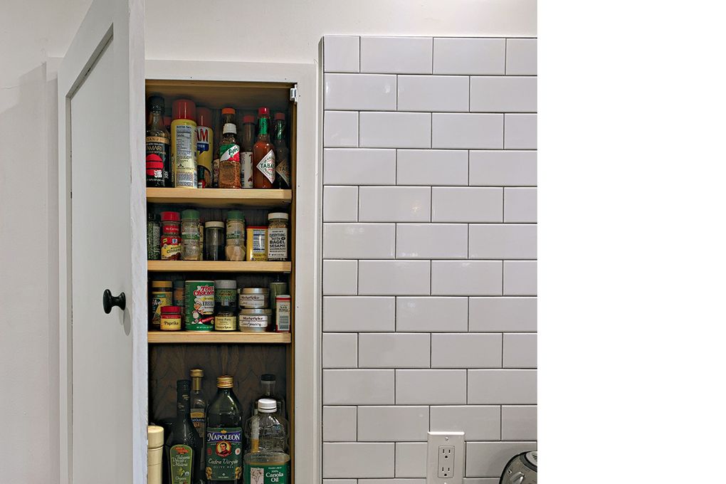 Recessed spaces between wall studs can be used for shelves to accommodate cooking spices and other small items that you want to have handy, yet out of sight. (Courtesy of 1AD Studio)