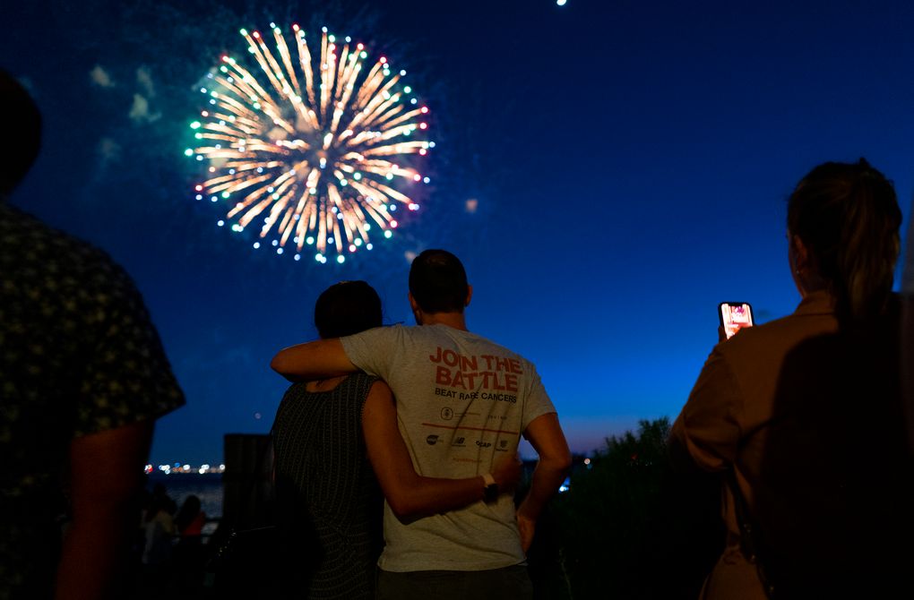 People watch as fireworks explode over New York Harbor as New York and other cities around New York state recognize a rate of 70% for single dose vaccinations against the COVID-19 virus, Tuesday, June 15, 2021 in New York. Celebration of the milestone was announced by Gov. Andrew Cuomo earlier in the day. (AP Photo/Craig Ruttle)