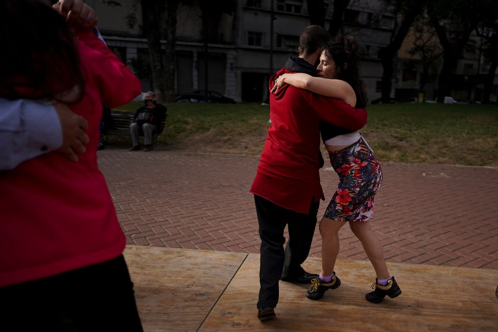 FILE – In this June 6, 2021 file photo, a couple dances tango at a park amid the COVID-19 pandemic lockdown in Buenos Aires, Argentina. Nostalgia for dance makes many tango dancers, or tangueros, defy restrictions with clandestine milongas in closed places or public spaces. (AP Photo/Natacha Pisarenko, File)