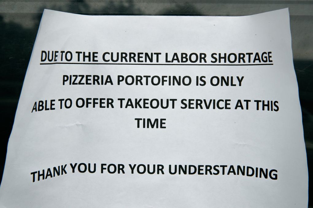A sign at Pizzeria Portofino, in Eastsound, Orcas Island, on Thursday. (Erika Schultz / The Seattle Times)