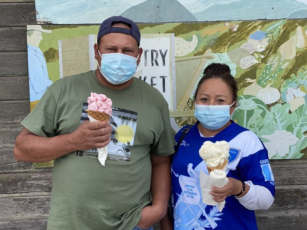 Eduardo and Angelica Interiano of Mount Vernon enjoy “Immodest” ice cream cones from Snow Goose Produce.  (Carol Pucci / Special to The Seattle Times)