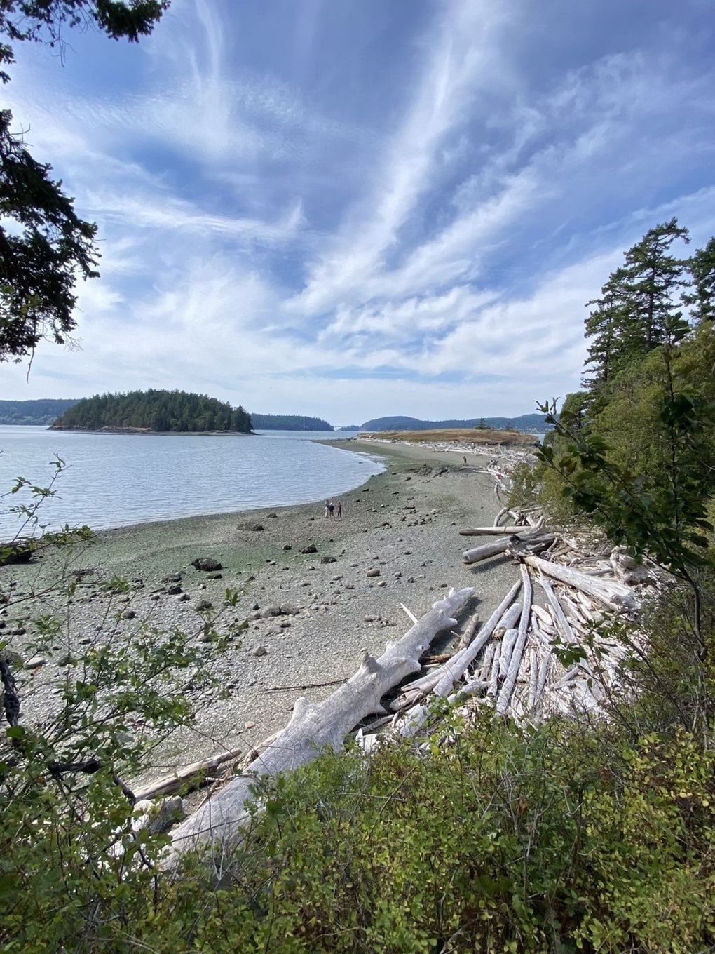 A gravel trail crosses a sand spit to Kiket Island in the Kukutali Preserve State Park Heritage Site.  (Carol Pucci / Special to The Seattle Times)