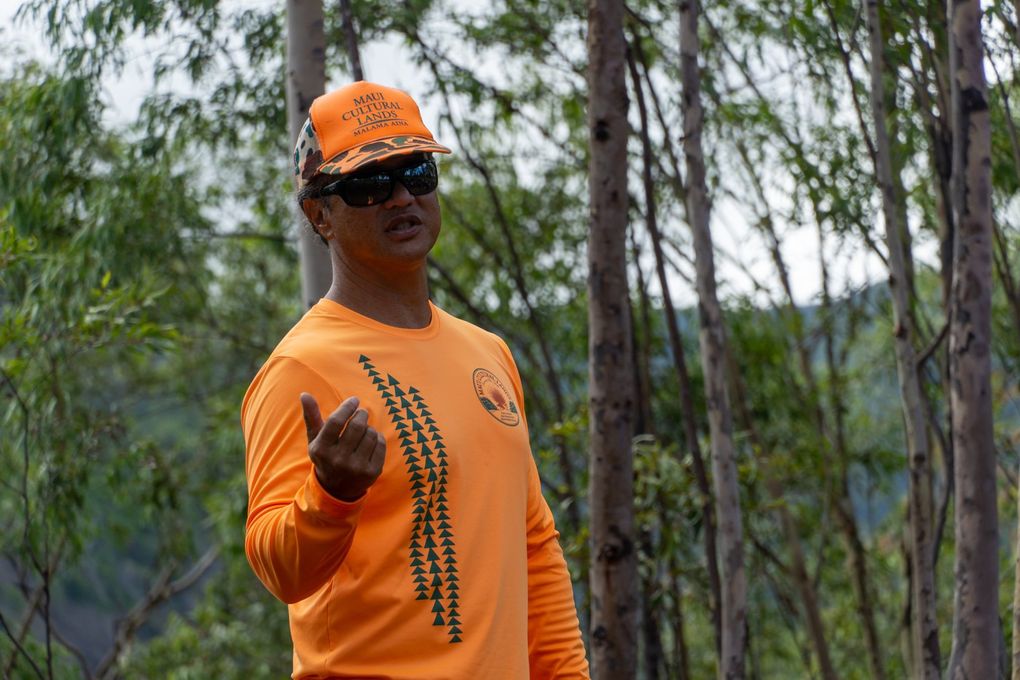 Edwin “Ekolu” Lindsey introduces volunteers, all of them tourists, to the Honokowai Valley, a culturally rich area formerly housing taro terraces which he and his family have been restoring since 1999.  (Colleen Stinchcombe / Special to The Seattle Times)